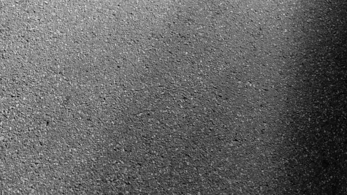 a black and white photo of a street